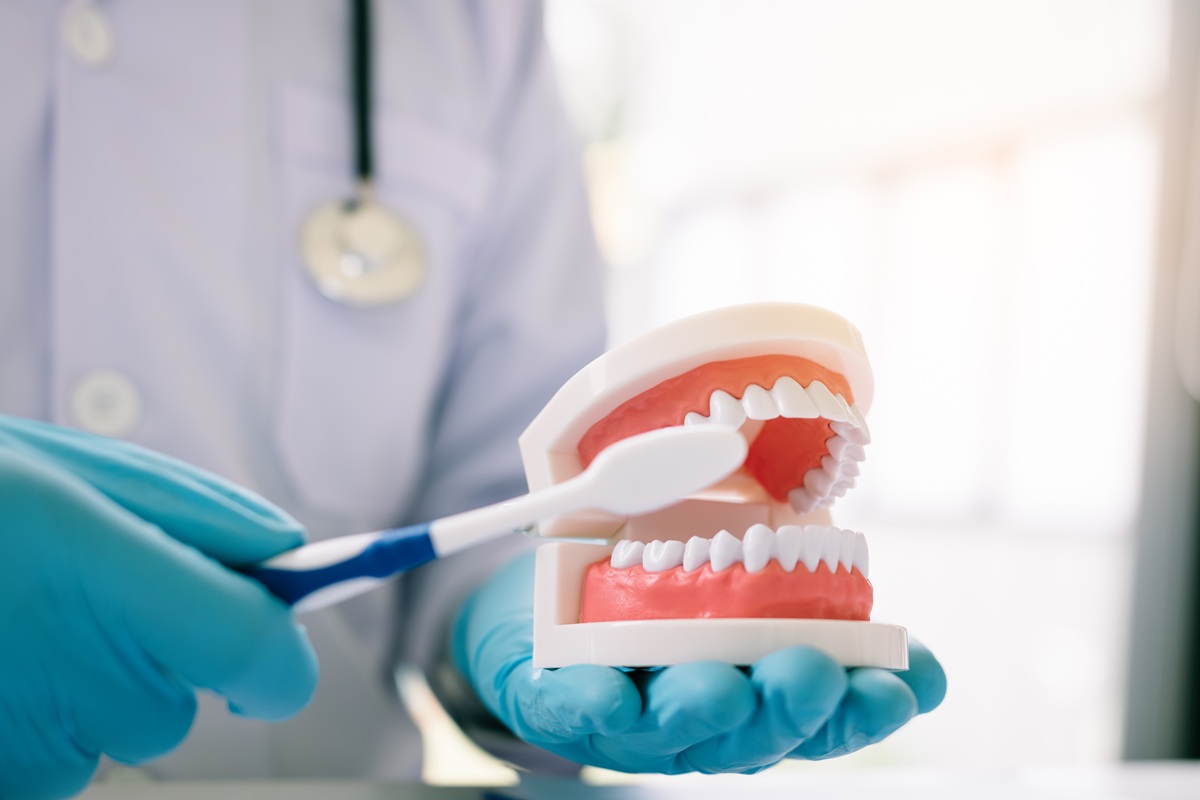 Dentist explaining complete and partial dentures
