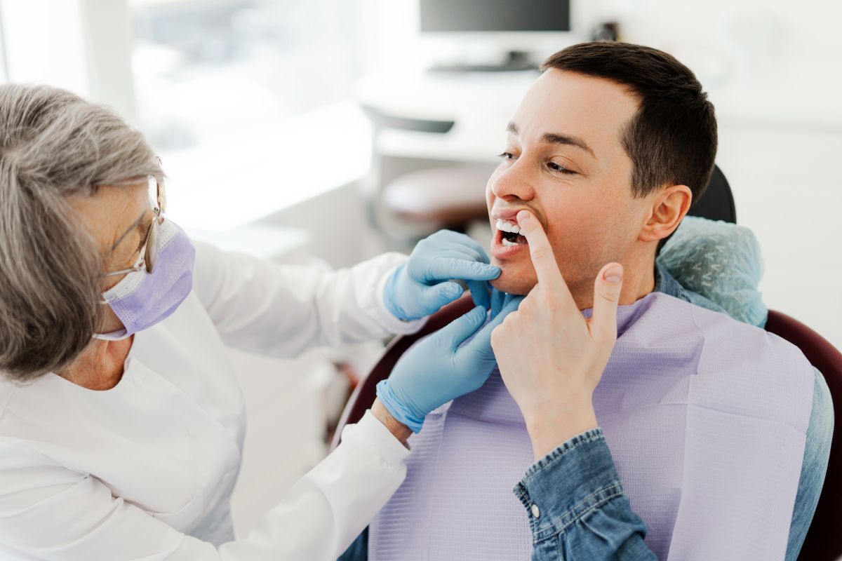 Dental Care Dentist examining patient's mouth during preventive dental care visit in Odessa, TX.